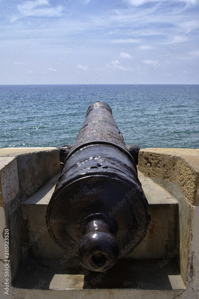 Old cannon overlooking Mediterannean Sea in Sitges, Spain