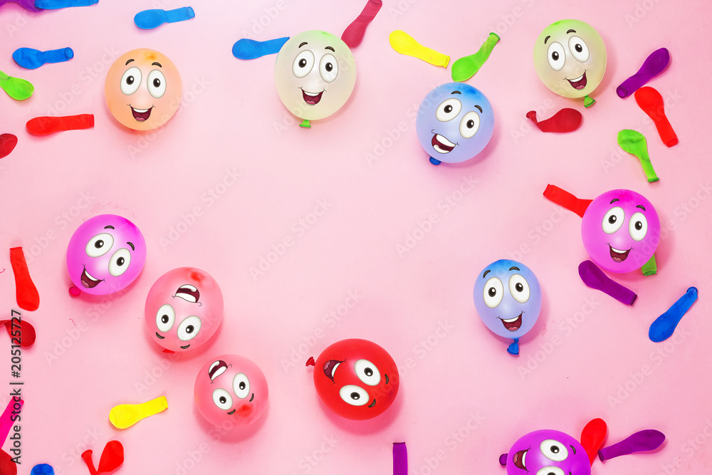 happy faces on colorful ballons for birthday on pink background , holiday concept