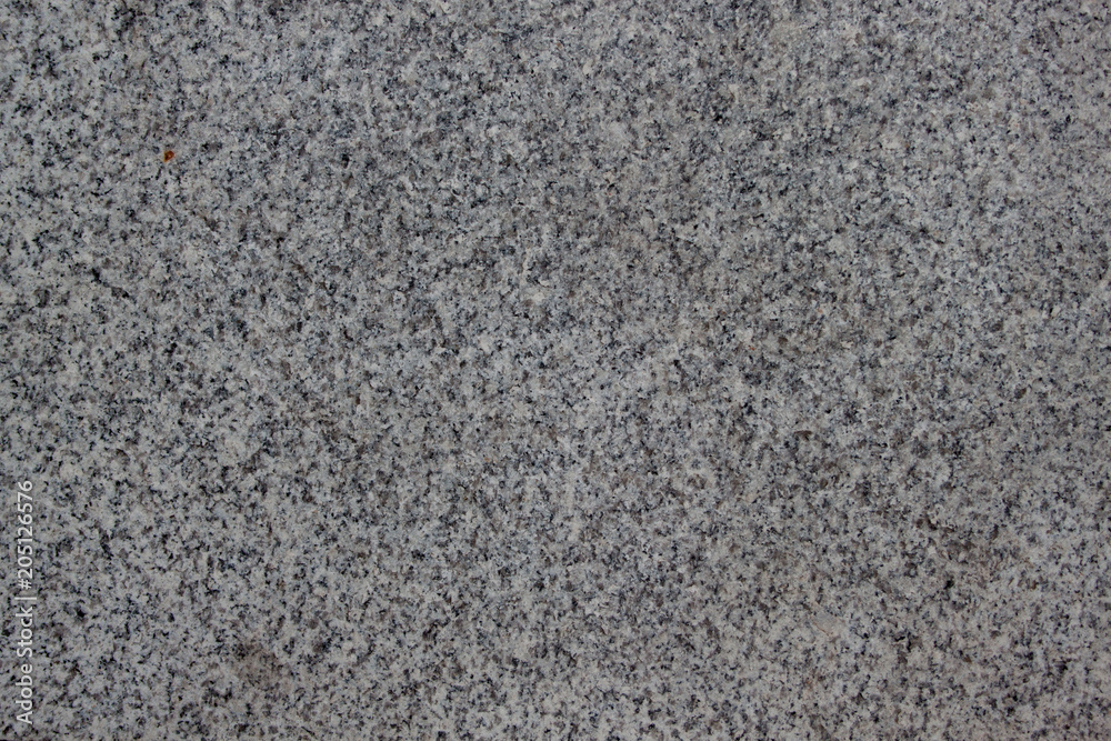 Gray grainy texture with marble chips. Used as a background. Gray grainy texture with marble chips. Used as a background.