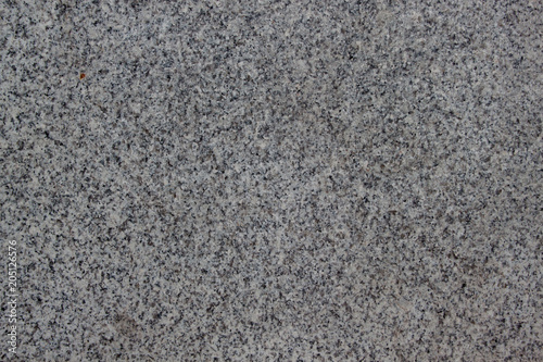 Gray grainy texture with marble chips. Used as a background.