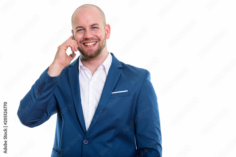 Studio shot of young bald muscular businessman Studio shot of young bald muscular businessman