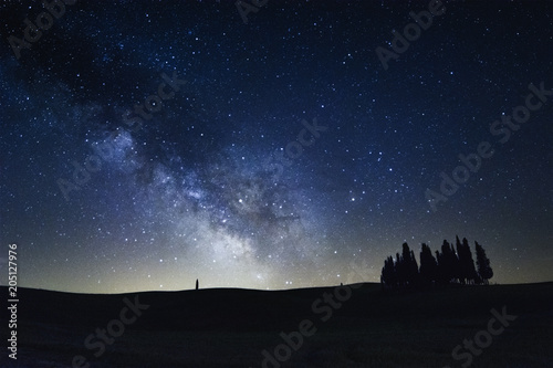 The Milky Way on the cypress trees of San Quirico d'Orcia