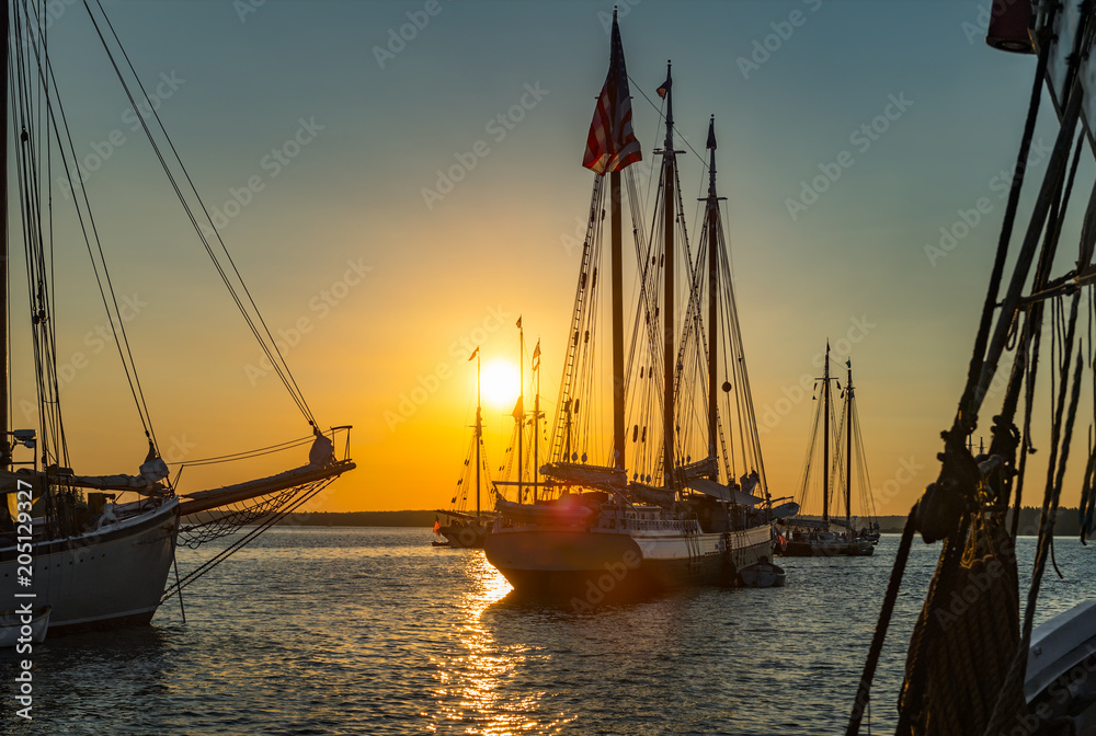 Wooden Boats Against Sunset