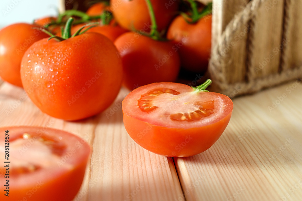 Close-up of fresh, ripe tomatoes on wooden background. Close-up of fresh, ripe tomatoes on wooden background.