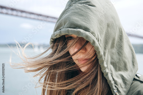 Принти на полотні Portrait of a beautiful brunette girl with hair fluttering in the wind and with