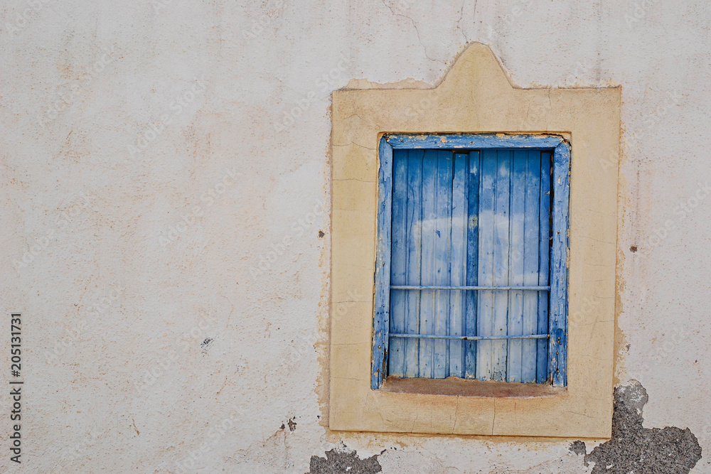 Old window on old town in Malia, Greece