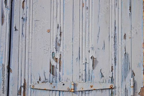 Old rustic  wooden door with hinge © Yulia Furman