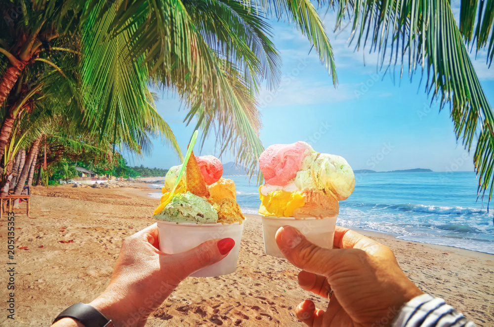 Couple with beautiful bright sweet Italian icecream with different
