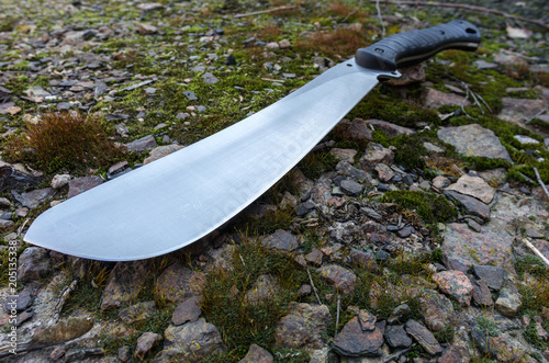 Large working knife. Photo of a machete at an angle. photo