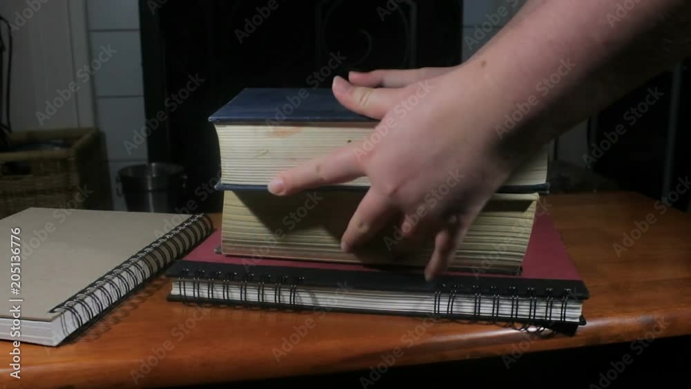 grabbing a stack of books