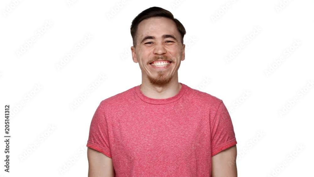 Portrait of positive man with hazel eyes laughing and expressing happiness, isolated over white background in studio closeup. Concept of emotions Portrait of positive man with hazel eyes laughing and expressing happiness, isolated over white background in studio closeup. Concept of emotions