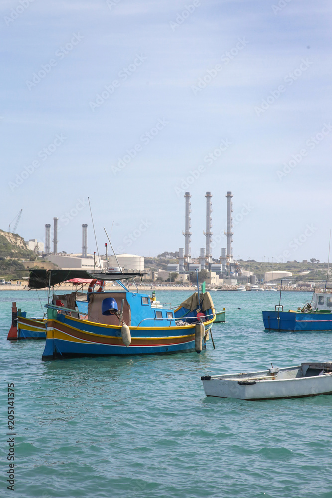 Traditional colorful fishing boats at Marsaxlokk Harbor, Malta