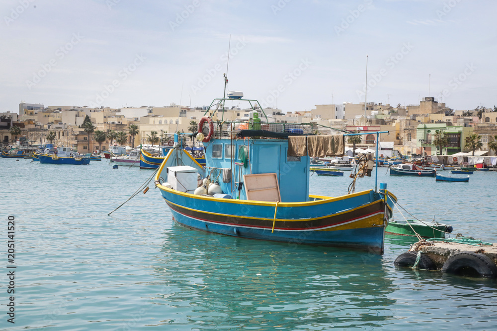 Traditional colorful fishing boats at Marsaxlokk Harbor, Malta