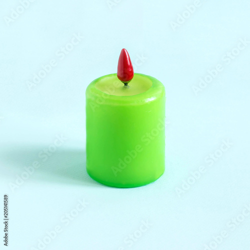 Creative idea: candle with hot pepper instead of fire photo