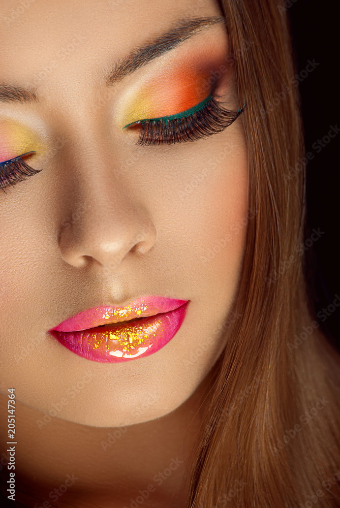 beautiful girl with glitter on her lips and multicolored eye shadows beautiful girl with glitter on her lips and multicolored eye shadows