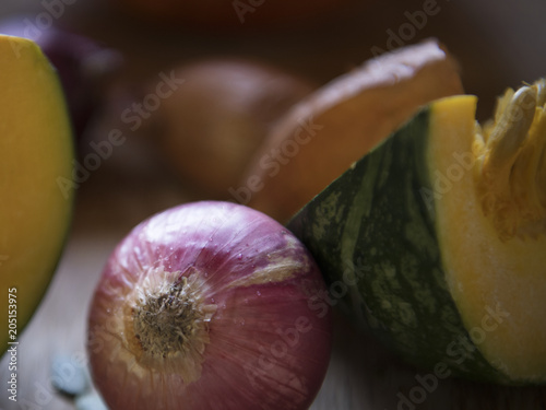 Close up of red onion and pumpkin food photography recipe idea photo