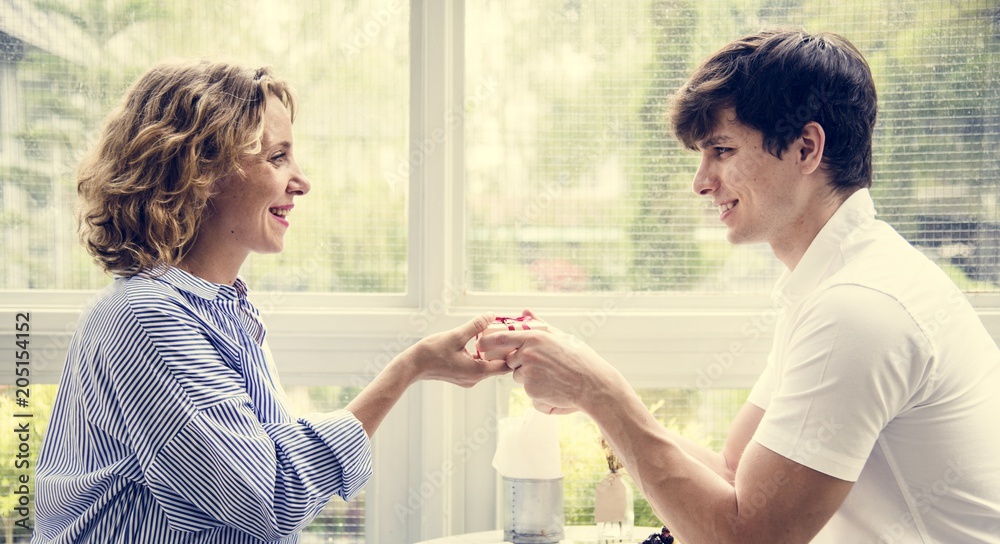 Fototapeta premium Couple celebrating anniversary at a cafe