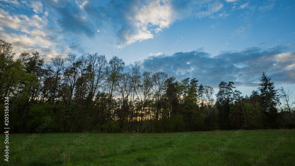 Beautiful evening or morning sky over meadow Beautiful evening or morning sky over meadow