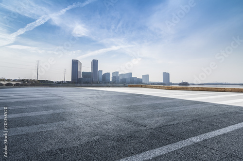 Panoramic skyline and buildings with empty road