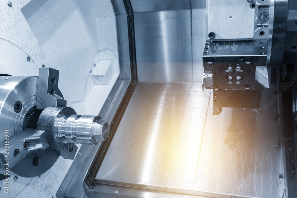 The CNC lathe machine chucking the raw material for turning process.The