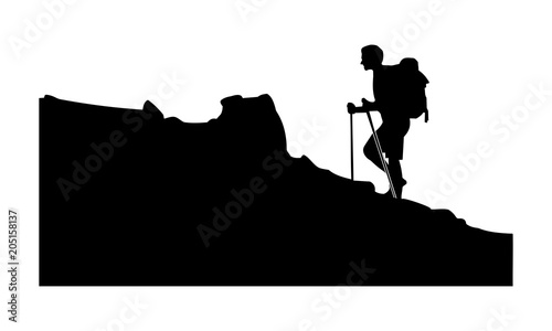 a silhouette of a man on a snowy climb
