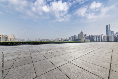 Panoramic skyline and buildings with empty concrete square floor，chongqing city，china