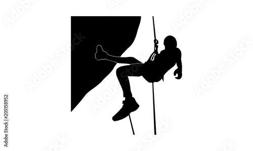 picture the silhouette of a male climber with the help of a rope