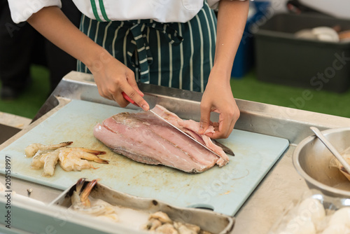 fresh fish cutting and prepare to cook by chef in a cooking class