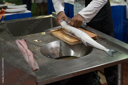 fresh fish cutting and prepare to cook by chef in a cooking class