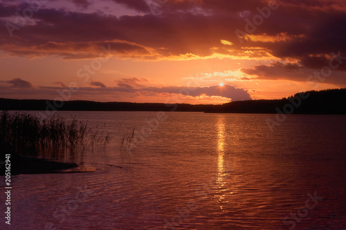 Beautiful sunset on the lake © Валерий Шейкин