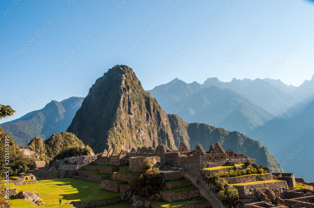 View of the amazing Machu Picchu, the lost Incan city,  Wayna Picchu and mountains.  Machu Picchu is One of the New Seven Wonders of the world. Peru