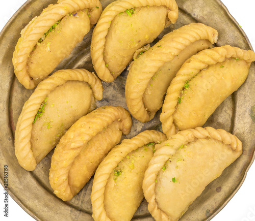 Gujiya or Gujia is a indian sweet dumpling made with suji, Maida or wheat flour and stuffed with khoya. It is common in North India, particularly in Bihar, Uttar Pradesh, Madhya Pradesh or Rajasthan