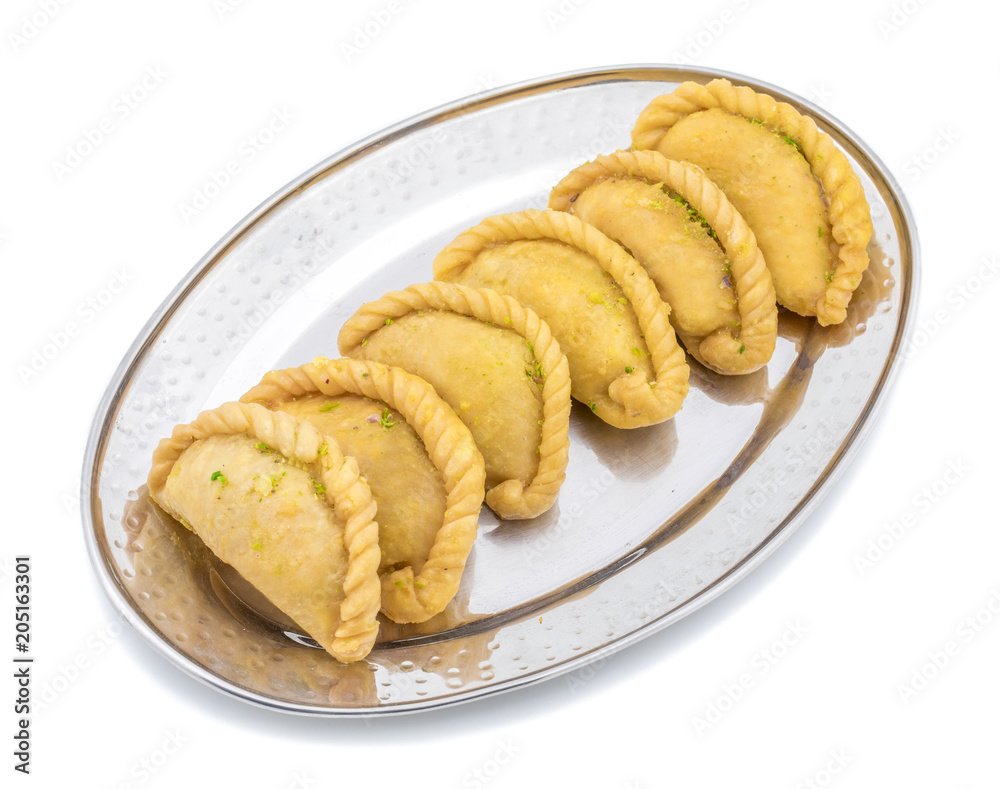 Gujiya or Gujia is a indian sweet dumpling made with suji, Maida or wheat flour and stuffed with khoya. It is common in North India, particularly in Bihar, Uttar Pradesh, Madhya Pradesh or Rajasthan Gujiya or Gujia is a indian sweet dumpling made with suji, Maida or wheat flour and stuffed with khoya. It is common in North India, particularly in Bihar, Uttar Pradesh, Madhya Pradesh or Rajasthan