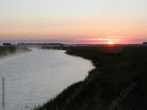 Sunrise on the river Chulym photo