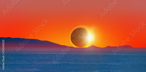 Fototapeta Naklejka Na Ścianę i Meble -  Beautiful landscape with Solar Eclipse - Beauty sunset over the sea 