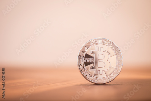 Cryptocurrency electronic silver Bitcoin with background copy space. photo