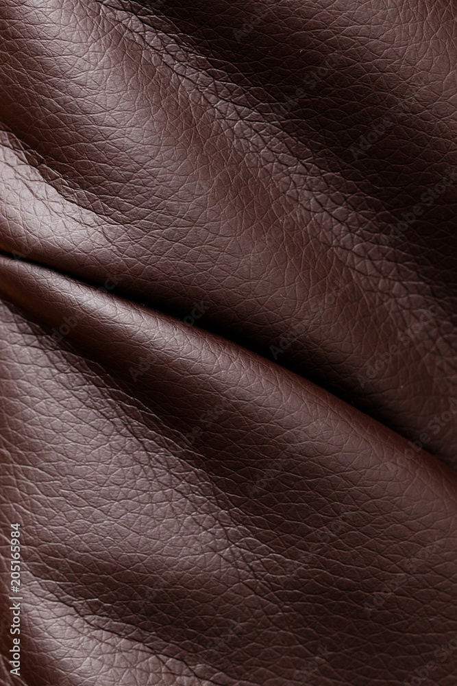 Brown leather material as an abstract background Brown leather material as an abstract background