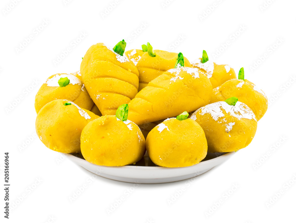 Indian Sweet Food Mango Mawa Pedha or Peda isolated on White Background Indian Sweet Food Mango Mawa Pedha or Peda isolated on White Background