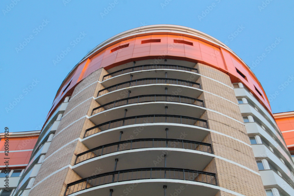 a modern building facade on the blue sky background