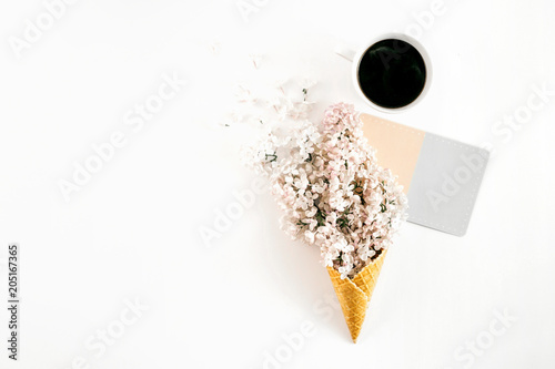 Top view ice cream cone branch white lilacs cup coffee empty card white background Minimal spring concept Flat lay