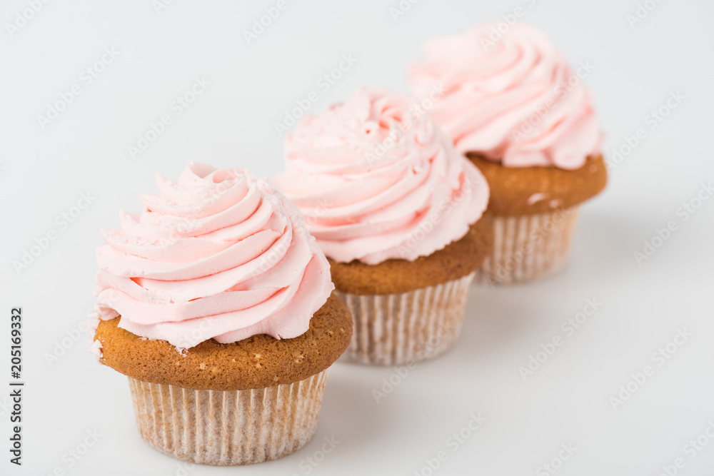 yummy cooked pink cupcakes on white
