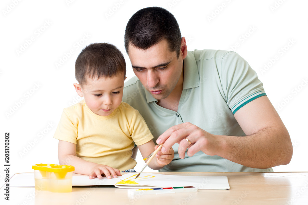 Dad and kid son playing with paint colors Dad and kid son playing with paint colors