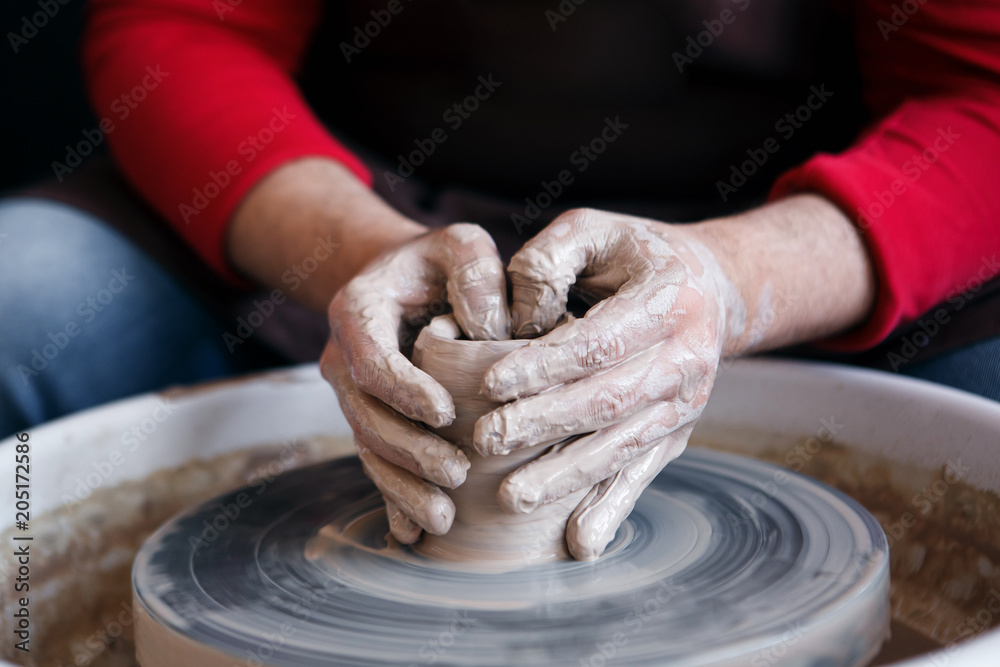 hands potter, male and female hands near the potter's wheel, potter's wheel