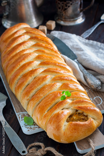 Fotografija Kulebyaka with cabbage, traditional pie in Russian cuisine, selective focus
