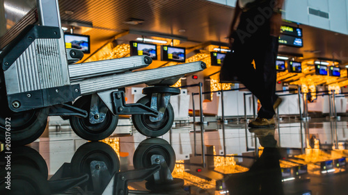 trolley / luggage cart in front of check-in counter in the airport
