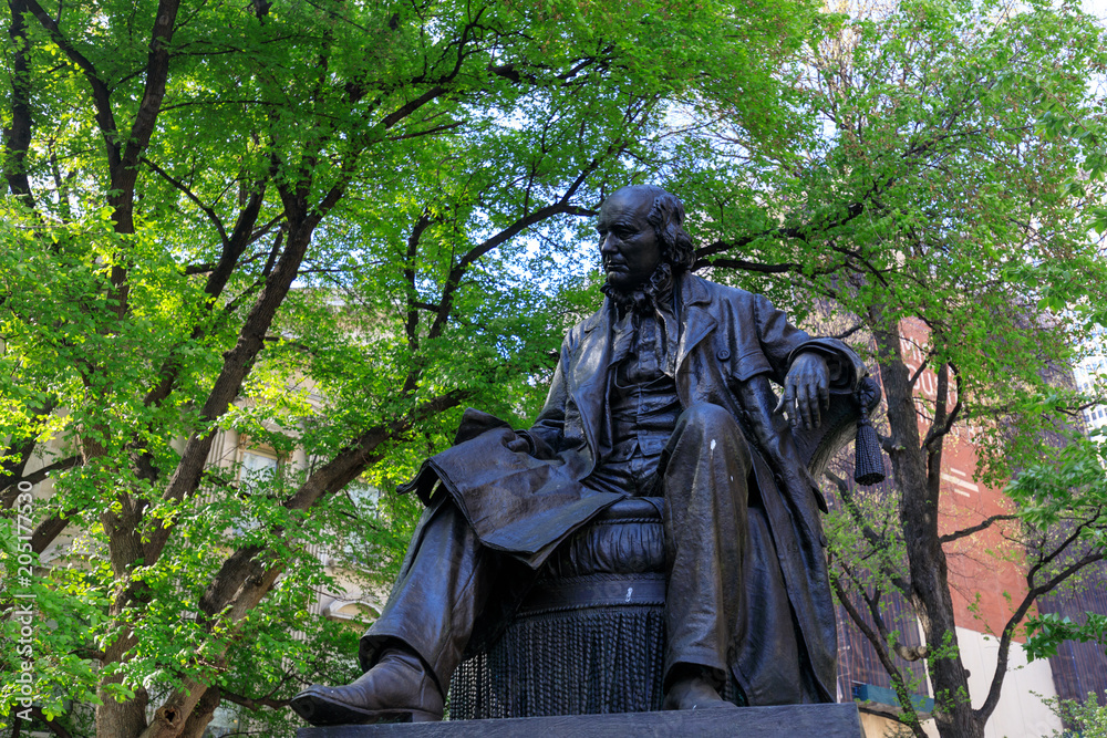 The bronze statue at City Hall Park in lower Manhattan in NYC The bronze statue at City Hall Park in lower Manhattan in NYC