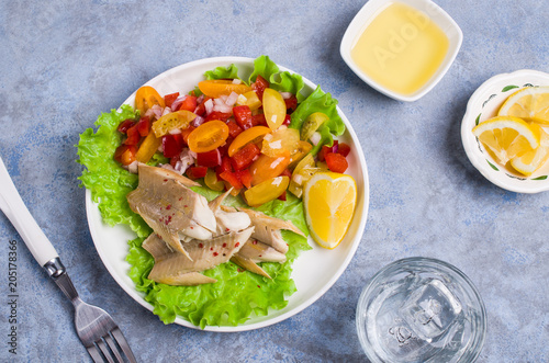 Fish fillet with raw vegetables