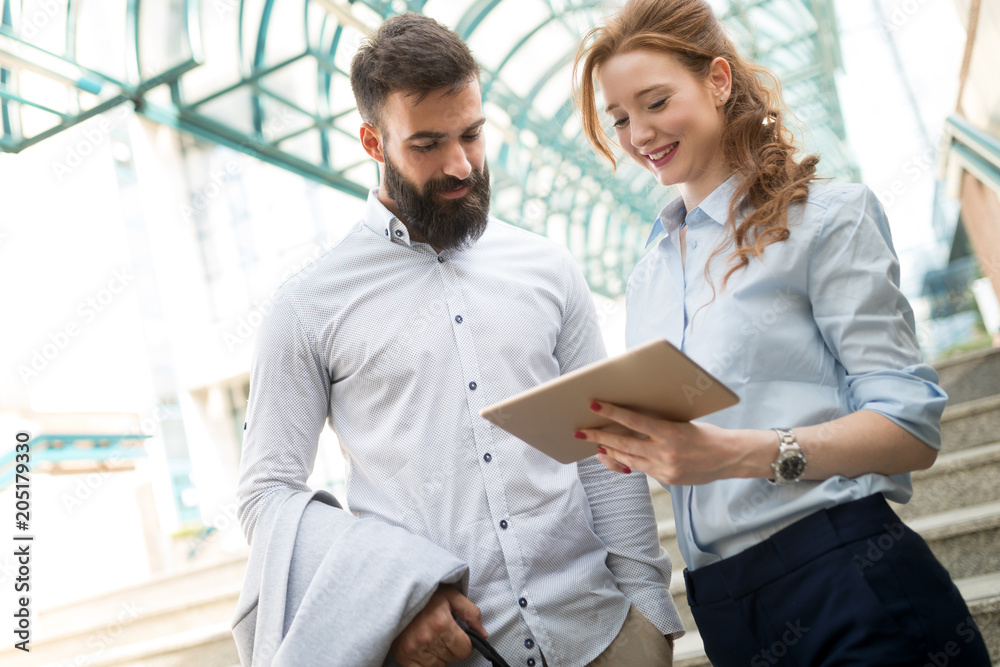 Smiling business man and woman chatting outdoor Smiling business man and woman chatting outdoor