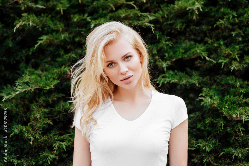 Young woman, against green background Young woman, against green background