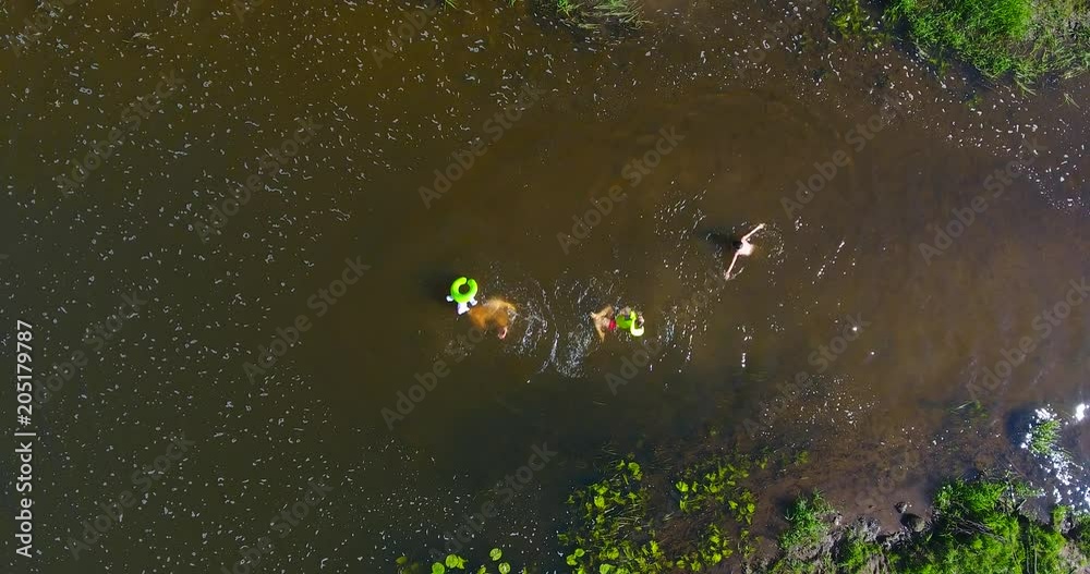 Upper view of happy kids splashing in the small river – 2 Upper view of happy kids splashing in the small river – 2